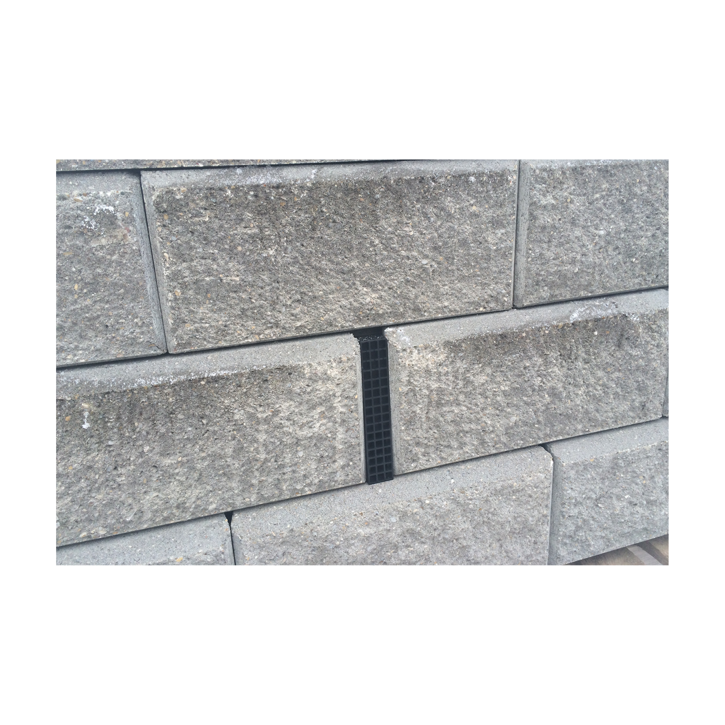 Black wall drain pro set in retaining wall