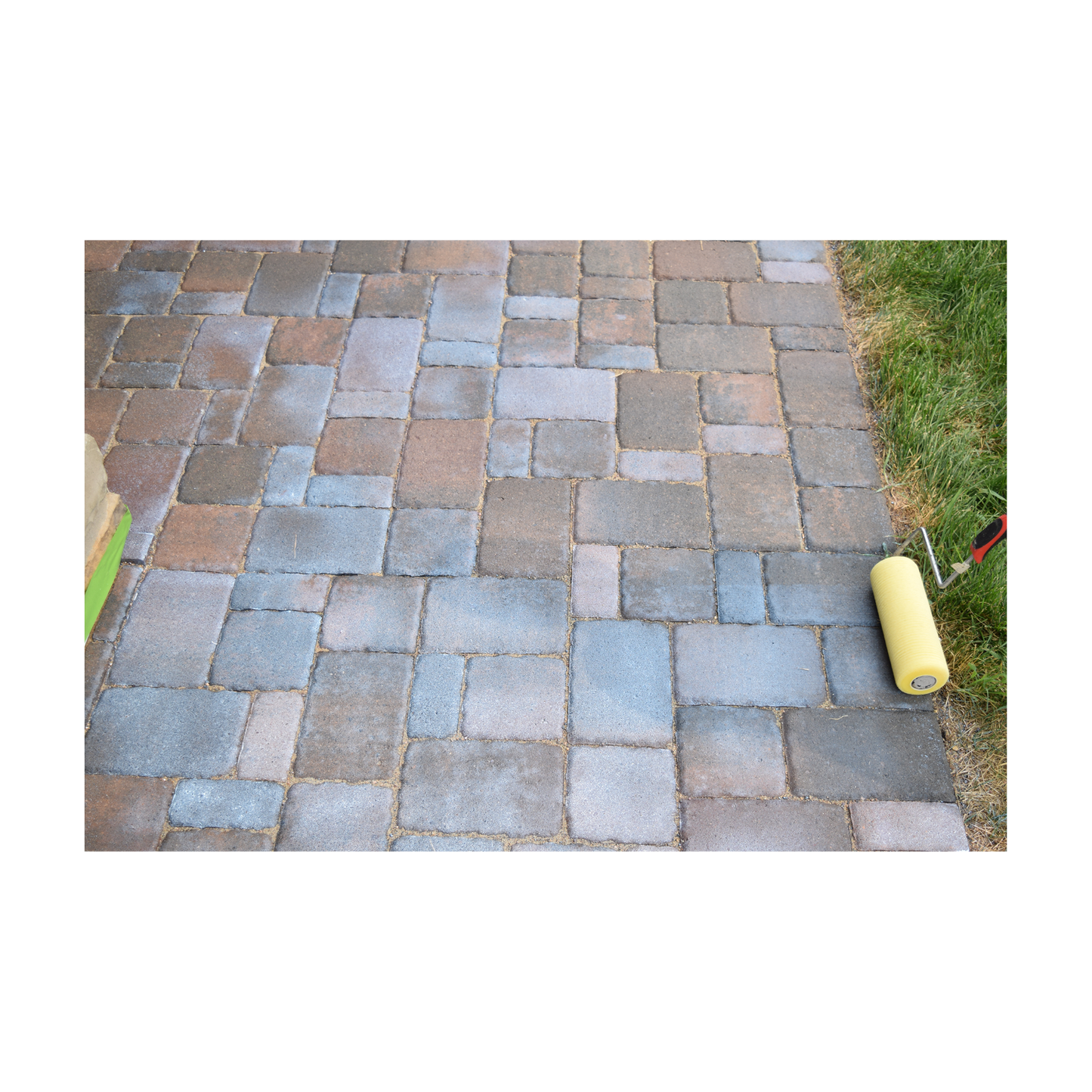 hardscape sealer being applied with a slit foam roller