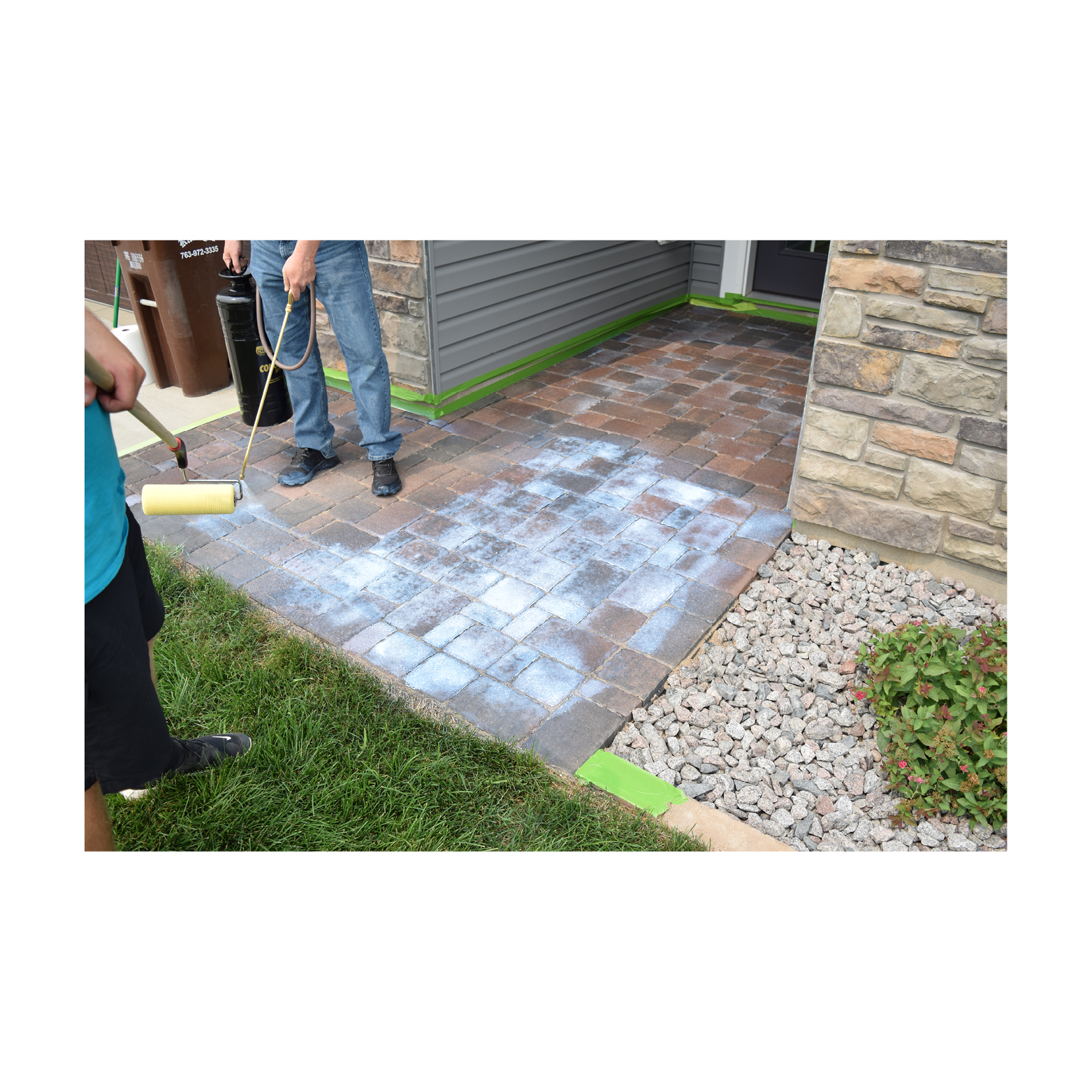 Applying low gloss paver sealer to entryway