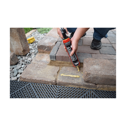 Applying SRW Products adhesive to patio block with caulking gun